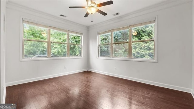 2040 Bloomfield Ct, Cumming, GA 30041 - spare room with ornamental molding, plenty of natural light, dark wood finished floors, baseboards, and ceiling fan