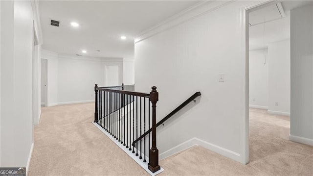 2040 Bloomfield Ct, Cumming, GA 30041 - hallway with an upstairs landing, attic access, light colored carpet, ornamental molding, and recessed lighting