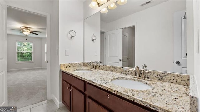 2040 Bloomfield Ct, Cumming, GA 30041 - full bathroom with double vanity, baseboards, ceiling fan, and tile patterned flooring