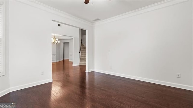 2040 Bloomfield Ct, Cumming, GA 30041 - empty room featuring stairs, crown molding, a chandelier, dark wood-style floors, and ceiling fan