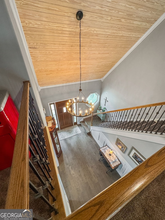 150 Crestview Rd, Jackson, GA 30233 - staircase featuring crown molding, a chandelier, wooden ceiling, wood finished floors, and healthy amount of natural light