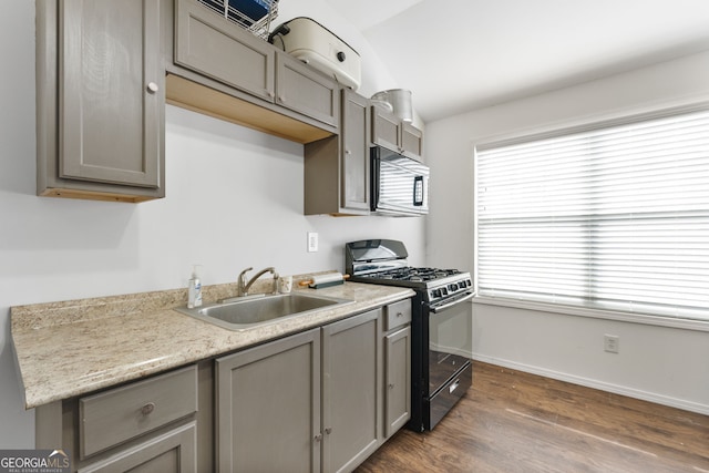 150 Crestview Rd, Jackson, GA 30233 - kitchen with black range with gas cooktop, gray cabinetry, a sink, light countertops, and dark wood-style flooring