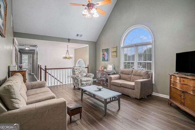 270 Meadow View Dr, Grayson, GA 30017 - living room with high vaulted ceiling, a ceiling fan, wood finished floors, a chandelier, and baseboards