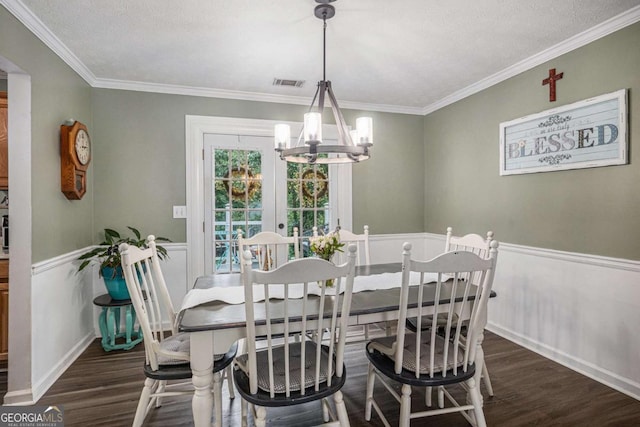 270 Meadow View Dr, Grayson, GA 30017 - dining space featuring a chandelier, wood finished floors, crown molding, and a wainscoted wall