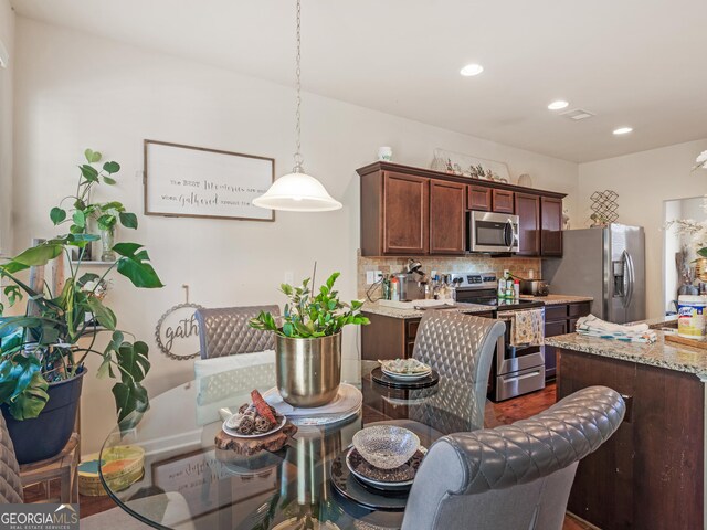 11755 Lovejoy Crossing Blvd, Hampton, GA 30228 - dining space featuring recessed lighting and dark wood finished floors