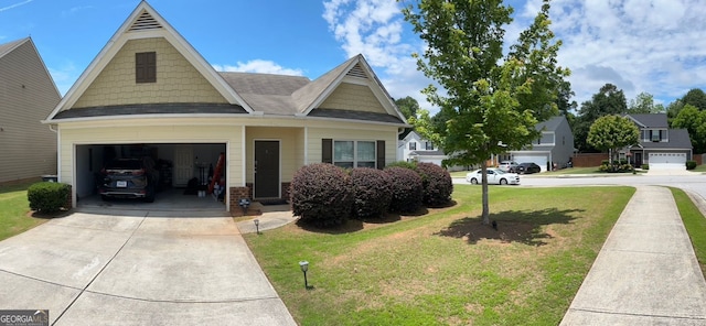 4241 Swamp Cypress Trl, Gainesville, GA 30504 - view of front facade featuring driveway, a front lawn, an attached garage, and brick siding