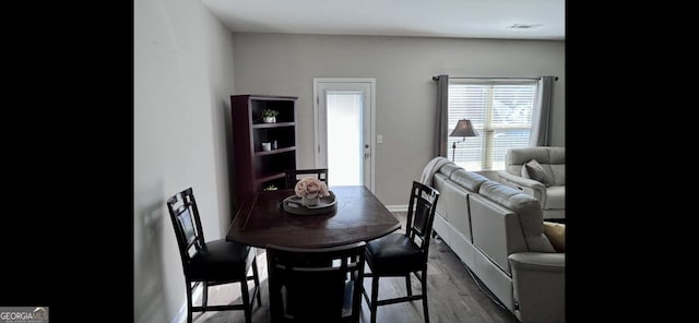 4241 Swamp Cypress Trl, Gainesville, GA 30504 - dining space with dark wood-style flooring and baseboards