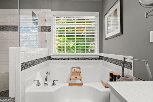 1504 Oglethorpe Dr, Suwanee, GA 30024 - full bath with a garden tub, healthy amount of natural light, and tiled shower