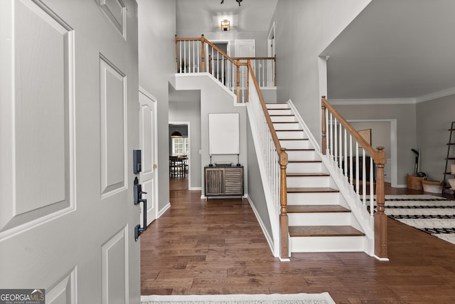 1504 Oglethorpe Dr, Suwanee, GA 30024 - foyer with stairway, wood finished floors, crown molding, and a high ceiling