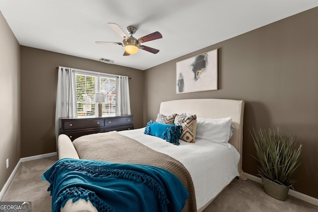1504 Oglethorpe Dr, Suwanee, GA 30024 - carpeted bedroom with baseboards and ceiling fan
