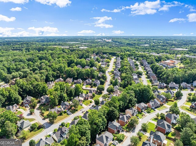1504 Oglethorpe Dr, Suwanee, GA 30024 - aerial perspective of suburban area with a forest