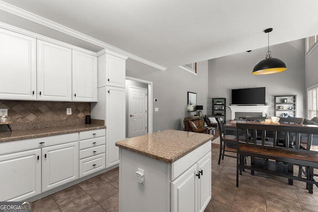 1504 Oglethorpe Dr, Suwanee, GA 30024 - kitchen with open floor plan, pendant lighting, white cabinetry, tasteful backsplash, and a center island