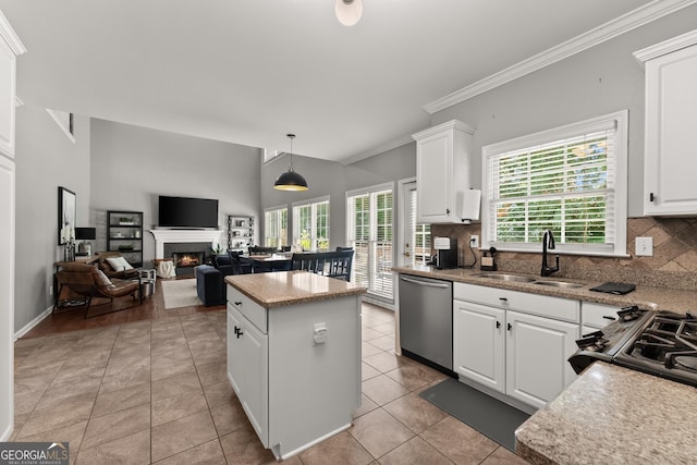 1504 Oglethorpe Dr, Suwanee, GA 30024 - kitchen featuring dishwasher, a warm lit fireplace, a center island, tasteful backsplash, and white cabinets