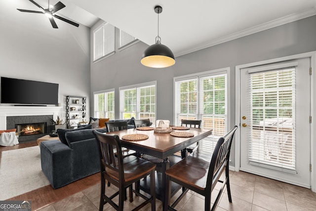 1504 Oglethorpe Dr, Suwanee, GA 30024 - dining area with a high end fireplace, ornamental molding, light tile patterned floors, and ceiling fan