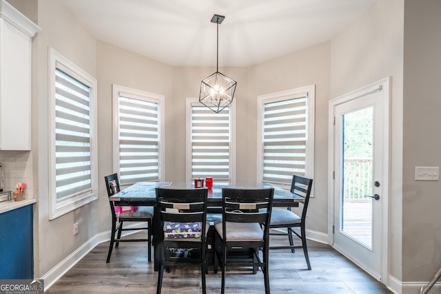 5490 Bent Grass Way, Douglasville, GA 30135 - dining room with a chandelier, wood finished floors, and baseboards