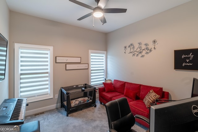 5490 Bent Grass Way, Douglasville, GA 30135 - carpeted living area featuring ceiling fan, healthy amount of natural light, and baseboards