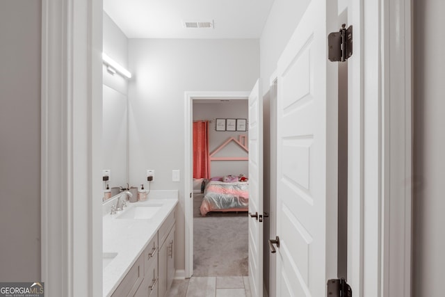 5490 Bent Grass Way, Douglasville, GA 30135 - bathroom with double vanity, connected bathroom, and tile patterned flooring