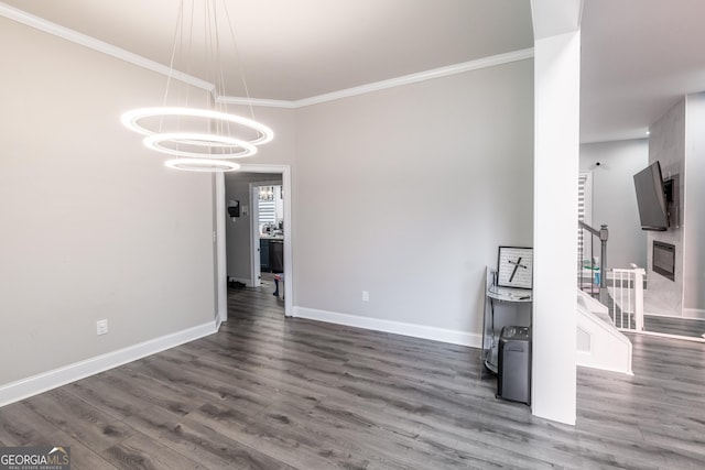 5490 Bent Grass Way, Douglasville, GA 30135 - unfurnished dining area with crown molding, wood finished floors, baseboards, stairs, and a chandelier