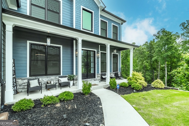 5490 Bent Grass Way, Douglasville, GA 30135 - property entrance with a porch, stone siding, and a yard