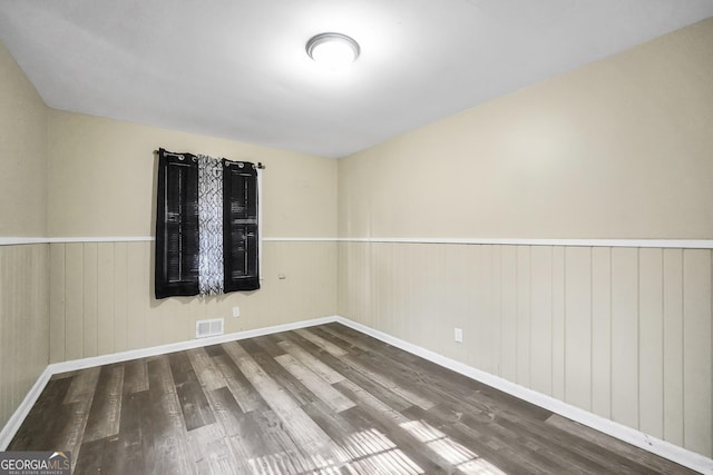 758 King Rd, Jonesboro, GA 30236 - spare room with wood finished floors, wainscoting, wooden walls, and baseboards