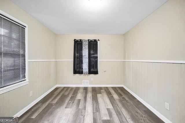758 King Rd, Jonesboro, GA 30236 - unfurnished room with wood finished floors and a wainscoted wall