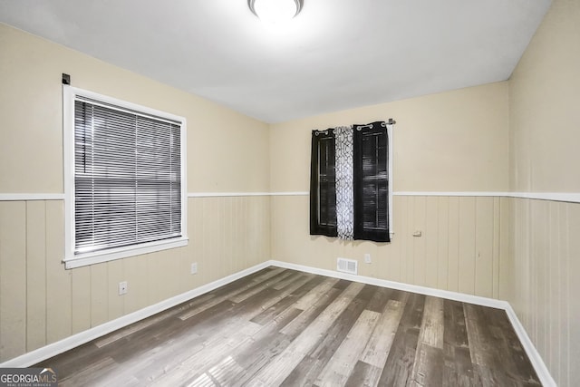 758 King Rd, Jonesboro, GA 30236 - spare room with wood finished floors, wainscoting, and wood walls