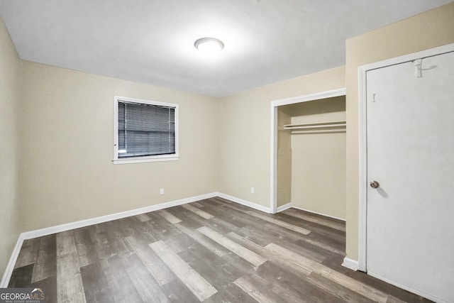 758 King Rd, Jonesboro, GA 30236 - unfurnished bedroom featuring wood finished floors and a closet