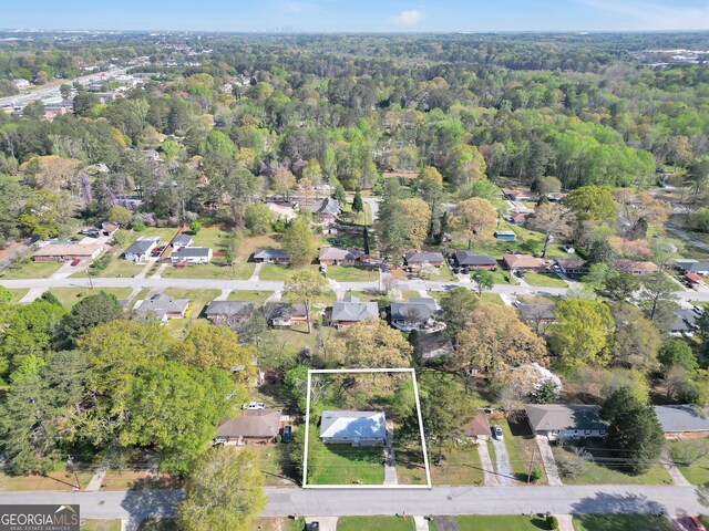 758 King Rd, Jonesboro, GA 30236 - aerial overview of property's location featuring property boundaries highlighted, a heavily wooded area, and nearby suburban area