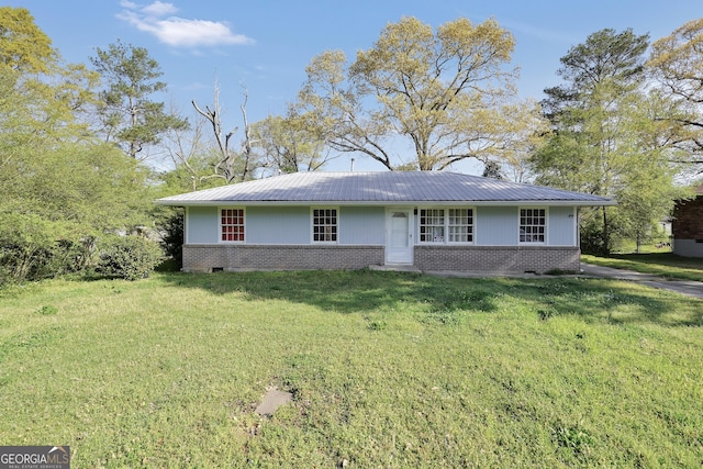 758 King Rd, Jonesboro, GA 30236 - single story home with brick siding, a front yard, and metal roof