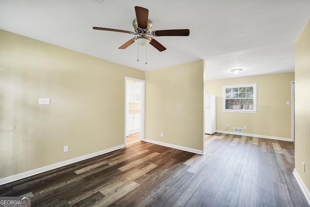 758 King Rd, Jonesboro, GA 30236 - spare room featuring dark wood finished floors, ceiling fan, and baseboards