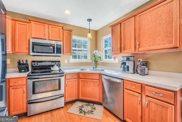 8870 Dornoch Cir, Winston, GA 30187 - kitchen with stainless steel appliances, a sink, light countertops, and recessed lighting