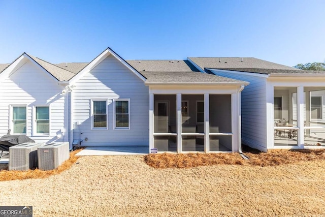 2133 Kirkham Way, Kennesaw, GA 30152 - back of house featuring a sunroom, central AC unit, a shingled roof, and a patio area