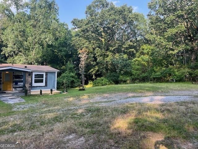 7138 Rockland Rd, Lithonia, GA 30038 - view of yard with a forest view