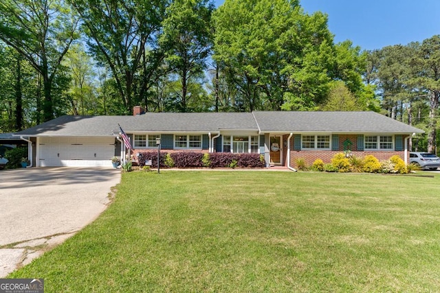 118 Duvall Dr, Stockbridge, GA 30281 - single story home with driveway, a chimney, a front lawn, and a garage