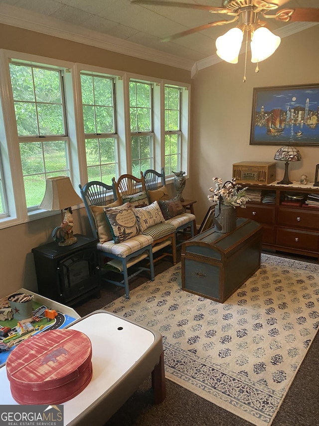 118 Duvall Dr, Stockbridge, GA 30281 - carpeted living room with ornamental molding, plenty of natural light, and a ceiling fan