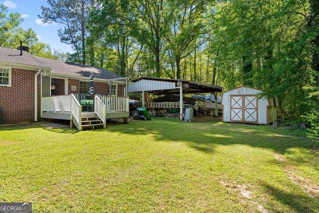 118 Duvall Dr, Stockbridge, GA 30281 - view of grassy yard featuring a storage shed, a wooden deck, and a detached carport