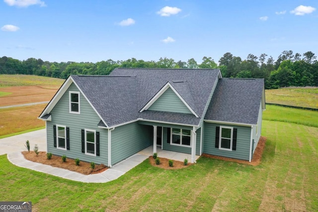 123 Oak Rd, Locust Grove, GA 30248 - traditional-style house featuring a shingled roof and a front lawn