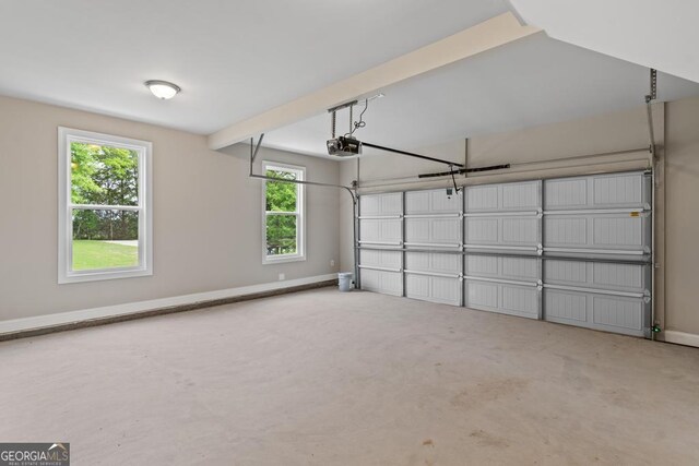 123 Oak Rd, Locust Grove, GA 30248 - garage with a garage door opener and baseboards