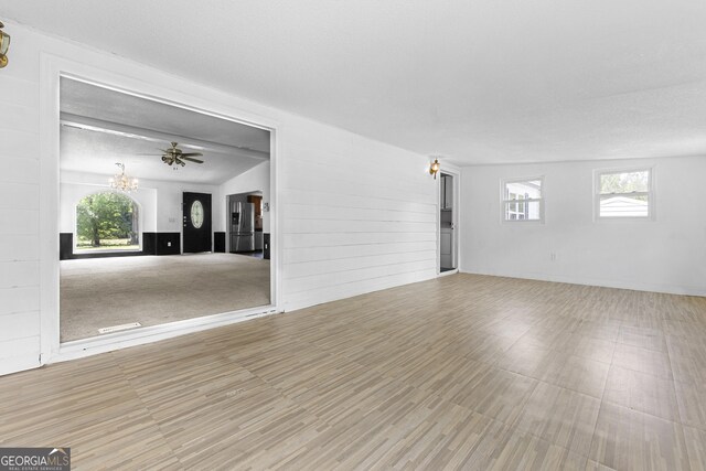 256 Battlefield Dr, Macon, GA 31217 - empty room with a chandelier and wood finished floors