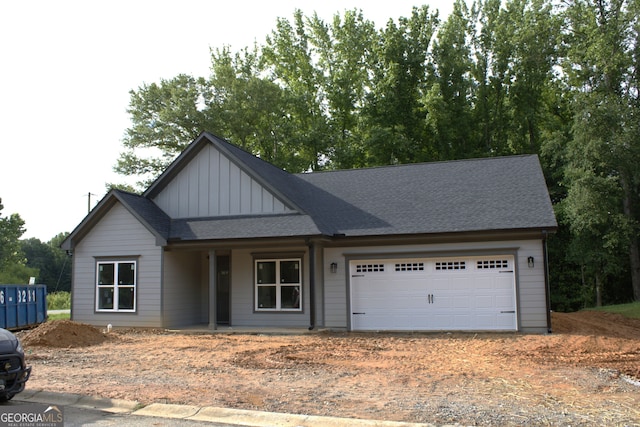 17 Fairview Sta, Hartwell, GA 30643 - view of front of home with dirt driveway, board and batten siding, a garage, a porch, and roof with shingles