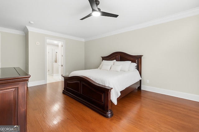 3280 Stillhouse Ln SE Unit 410, Atlanta, GA 30339 - bedroom with ornamental molding, wood finished floors, baseboards, ensuite bathroom, and ceiling fan