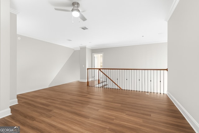 3280 Stillhouse Ln SE Unit 410, Atlanta, GA 30339 - empty room featuring a ceiling fan, wood finished floors, ornamental molding, and baseboards