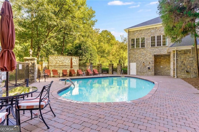 3280 Stillhouse Ln SE Unit 410, Atlanta, GA 30339 - community pool featuring a patio