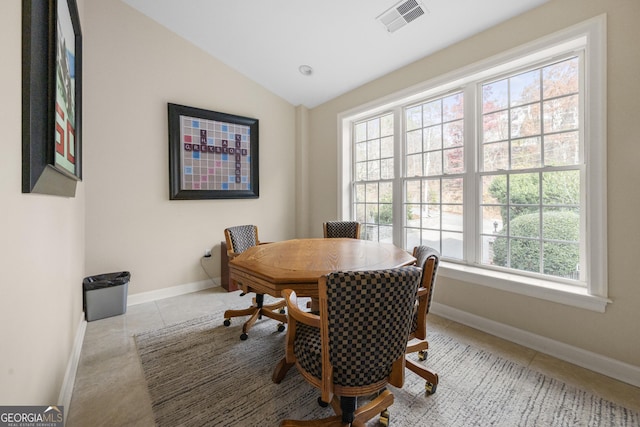 3280 Stillhouse Ln SE Unit 410, Atlanta, GA 30339 - tiled dining room featuring healthy amount of natural light, lofted ceiling, and baseboards