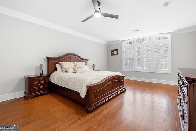 3280 Stillhouse Ln SE Unit 410, Atlanta, GA 30339 - bedroom with ornamental molding, baseboards, wood finished floors, and ceiling fan