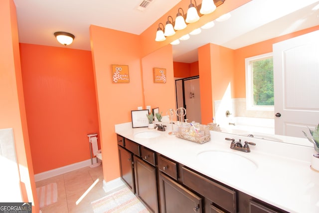 4560 Buckskin Way, Douglasville, GA 30135 - bathroom with a shower stall, a garden tub, tile patterned floors, double vanity, and toilet