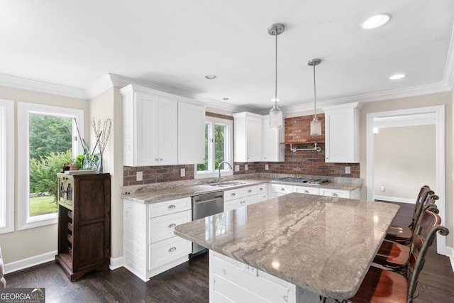 1645 Oakfield Ln, Roswell, GA 30075 - kitchen with appliances with stainless steel finishes, healthy amount of natural light, a sink, white cabinetry, and crown molding