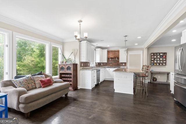 1645 Oakfield Ln, Roswell, GA 30075 - living area with crown molding, dark wood-style floors, and recessed lighting