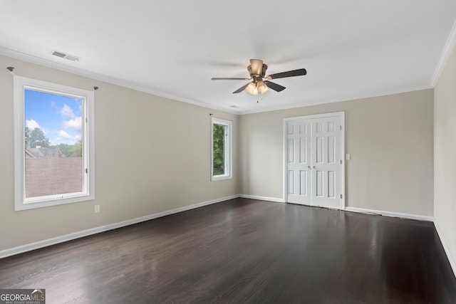 1645 Oakfield Ln, Roswell, GA 30075 - unfurnished bedroom with dark wood-style floors, baseboards, a closet, ornamental molding, and a ceiling fan