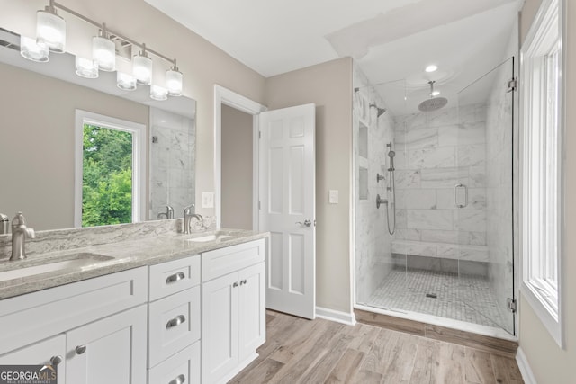 1645 Oakfield Ln, Roswell, GA 30075 - full bath featuring a stall shower, baseboards, double vanity, and wood finished floors